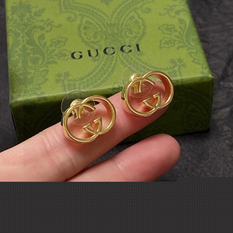 G*u*i earrings